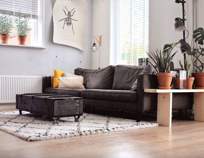 black two-seat sofa and coffee table inside room