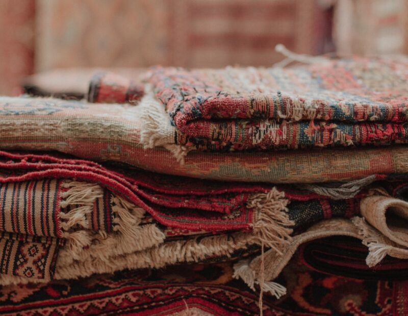 a pile of rugs stacked on top of each other